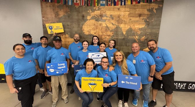Image – 2025-08-15T143209.579 IDM Cares team volunteering at Feed My Starving Children